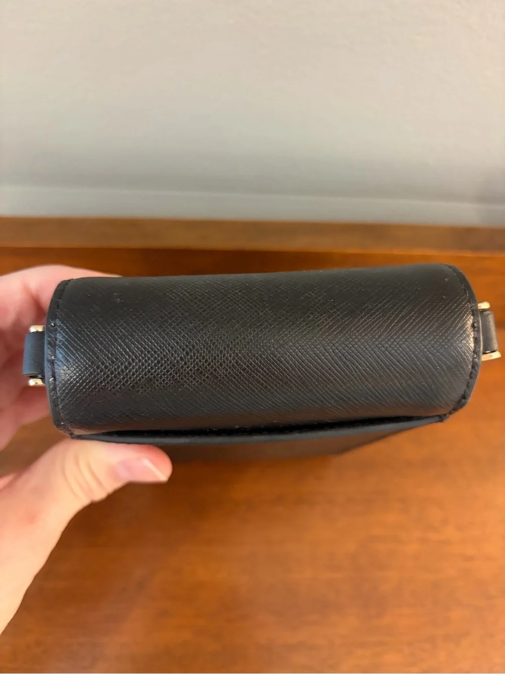 kate spade black saffiano leather phone pouch with gold logo